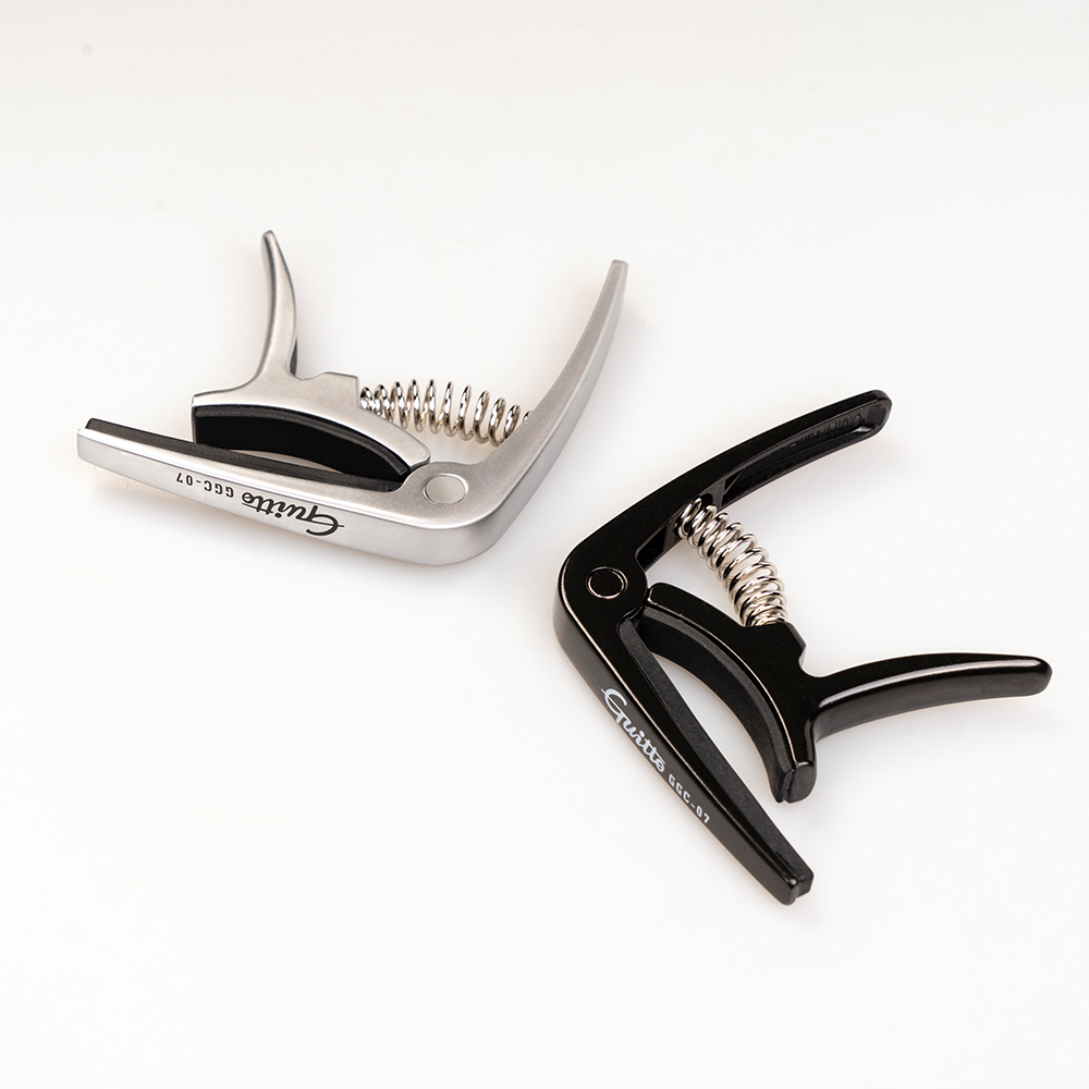 GUITTO GGC-07 Ukulele Capo Qui - Musical Instrument Types recension och pris